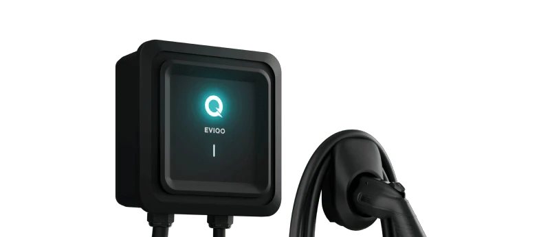 The EvoCharge mounted on a wall with the cord neatly hung beside it.